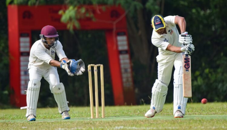 Two cricket players in the field